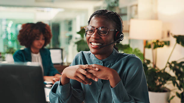 A Pure Wild travel consultant smiling while taking a client enquiry